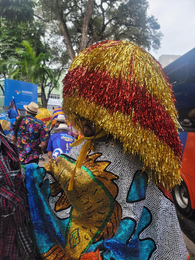 A maracatu dancer poses for a photo on the streets of Recife, Brazil.